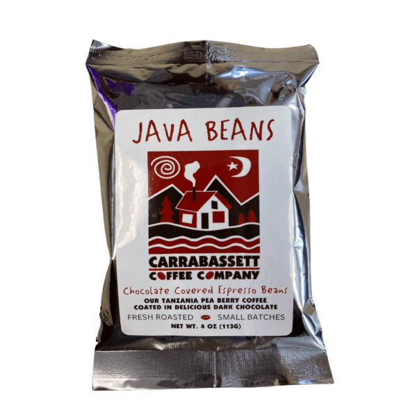 Photograph of a silver colored packet containing chocolate covered epsresso beans. The words: Java Beans are written in red across the top, above the Carrabassett Coffee company logo. Text below the logo reads: "Chocolate Covered Espresso Beans. Our Tanzania Peaberry Coffee coated in delicious dark chocolate. Fresh Roasted- Small Batches. Net weight 4 oz (113g)."