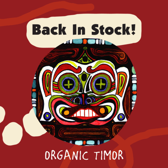 Text reads: Back in Stock! Organic Timor. Image contains the label artwork for Organic Timor, along with the text above a red background with squiggles.