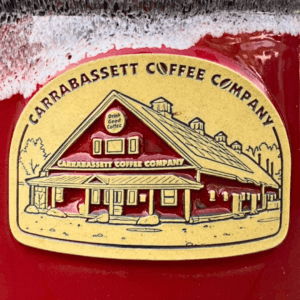Close Up Image of the Carrabassett Coffee Company Big Mug Medallion featuring the coffee Roastery.